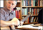 photo of Billy Bragg writing a song